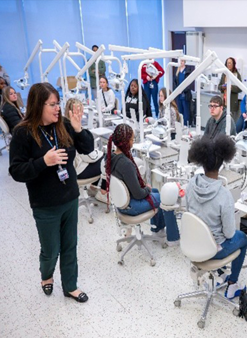 Area high school students working in the dental lab