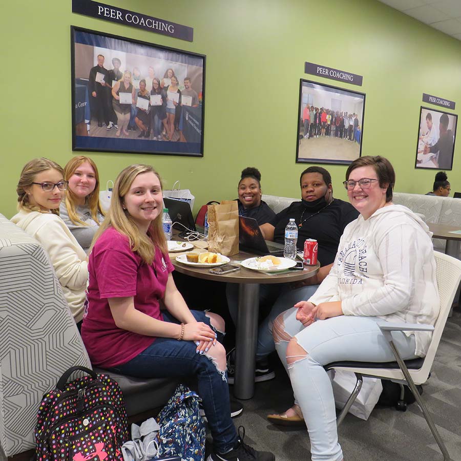 Six Female Students at Table