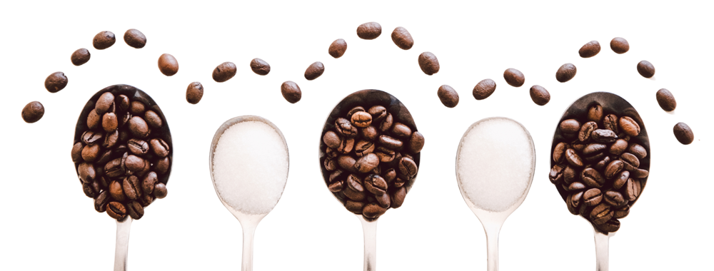 coffee grouds and sugar in lined up spoons.