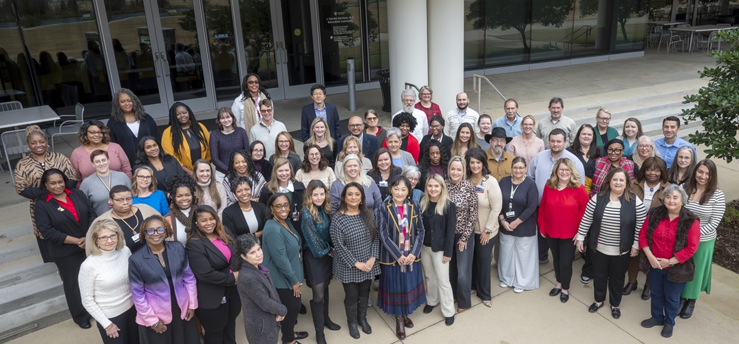 MCG faculty & staff outside of the Harrison Commons Building