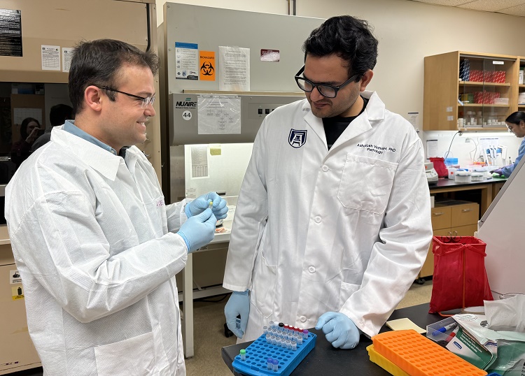 Two members of the Pathology lab talking