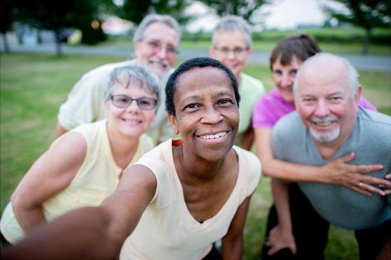 people of diverse backgrounds posing for camera