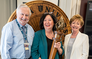 Pam Cromer pictured with former Augusta University President Brooks Keel and Debbie Layman