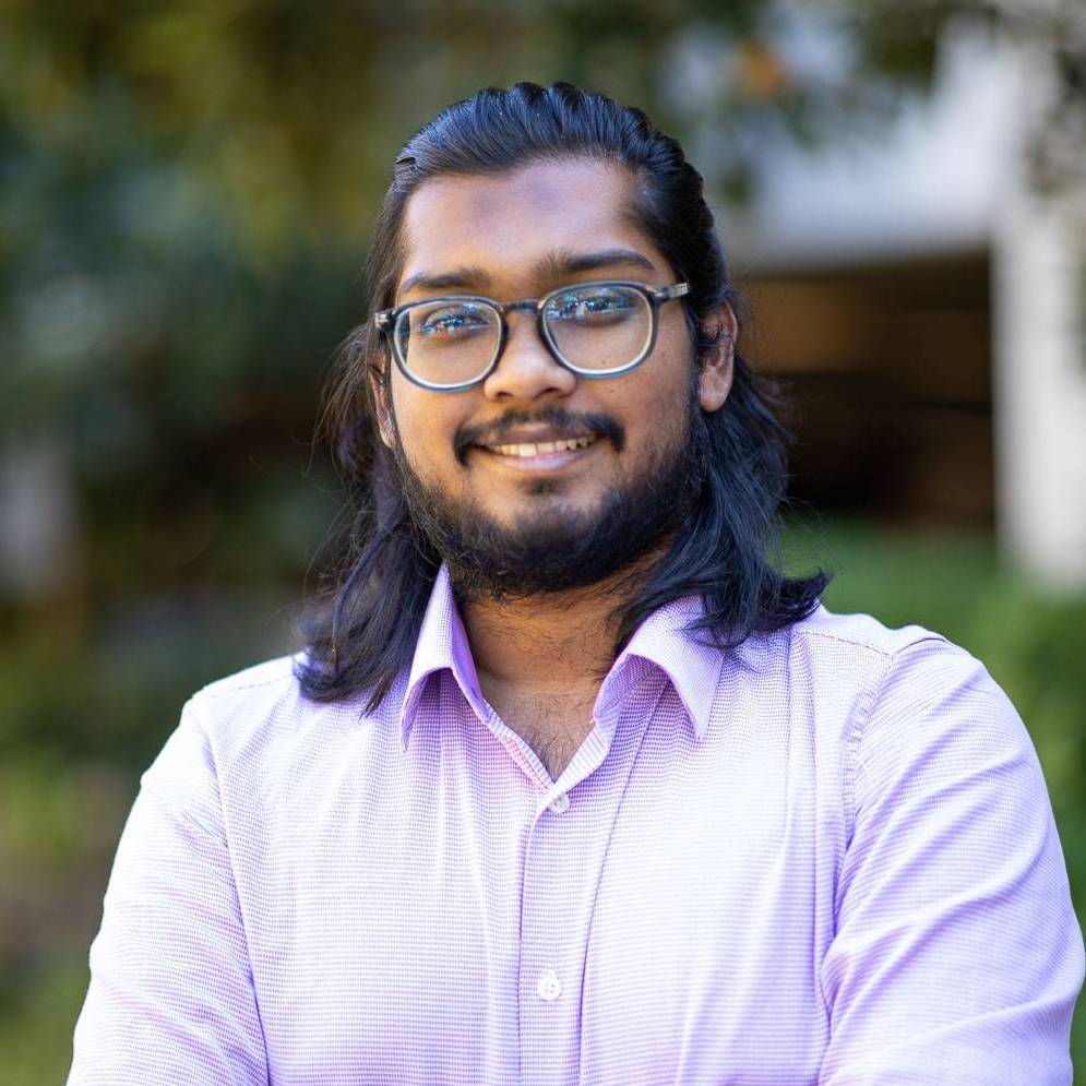 Headshot of Arif Hassan Zidan smiling at the camera