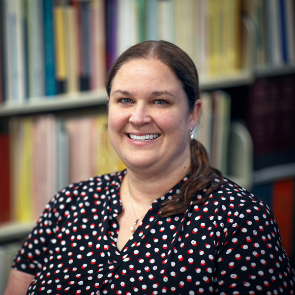 Ashley Dieteterich in front of book case