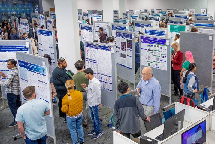 Graduate students presenting posters