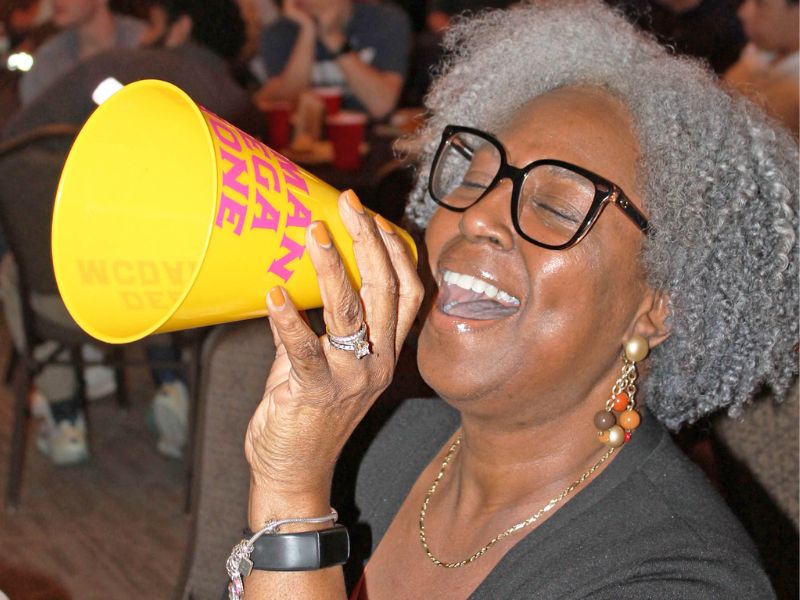 Debra McDaniel holding a megaphone