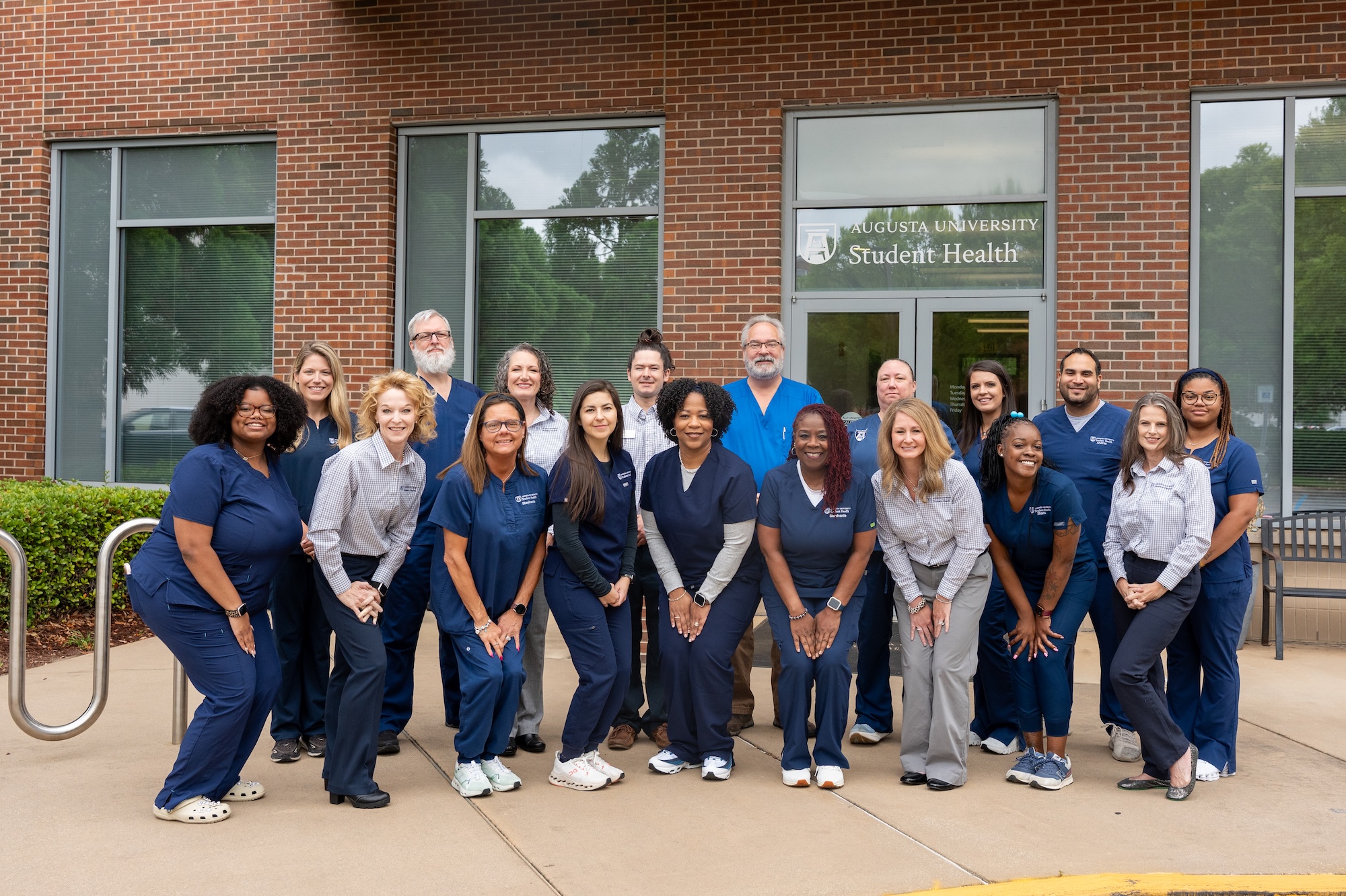 SHS staff group photo outside of clinic