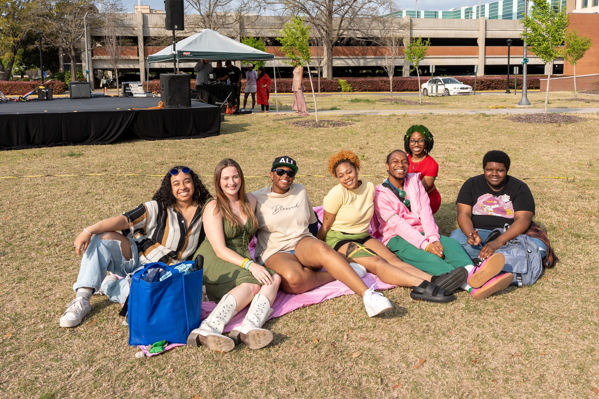 students sitting on lawn