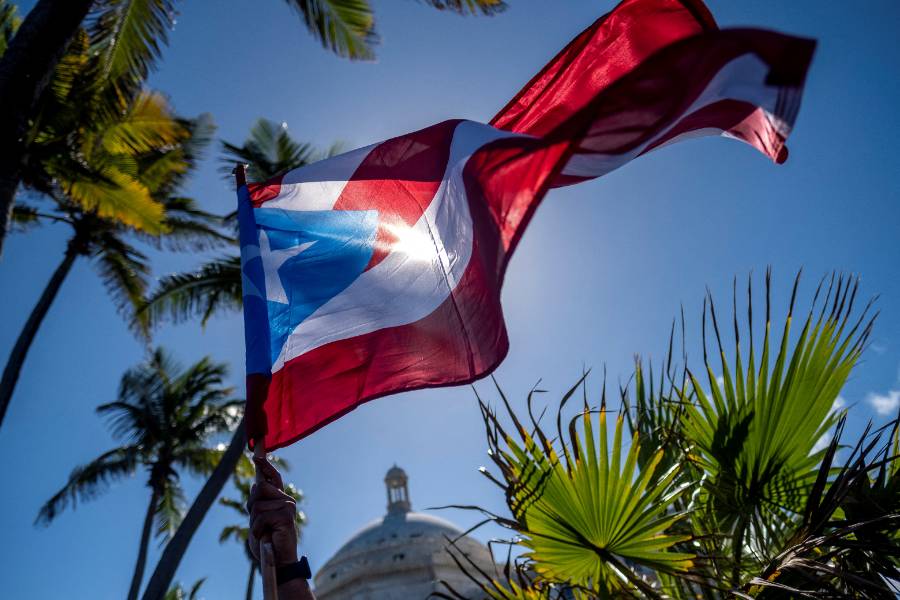 flag flying against blue sky