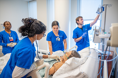 Group of students working on a mannequin